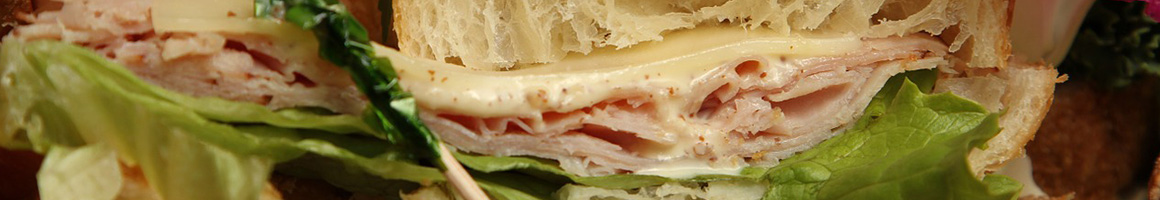 Eating Sandwich at JC's Sandwich Shop restaurant in Tampa, FL.